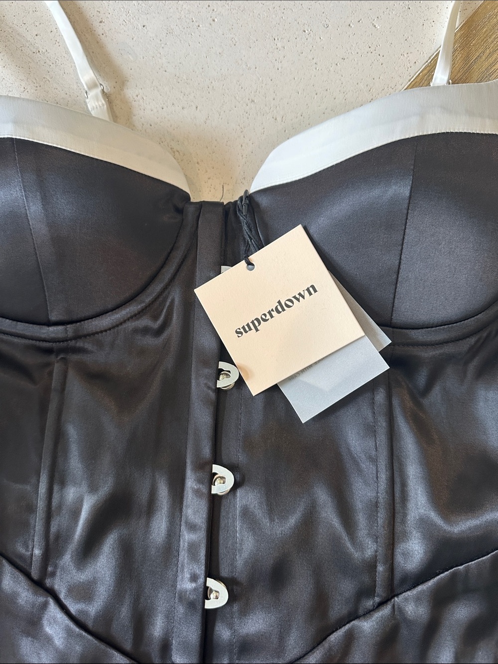 Revolve Superdown black satin mini dress with corset middle and white trim